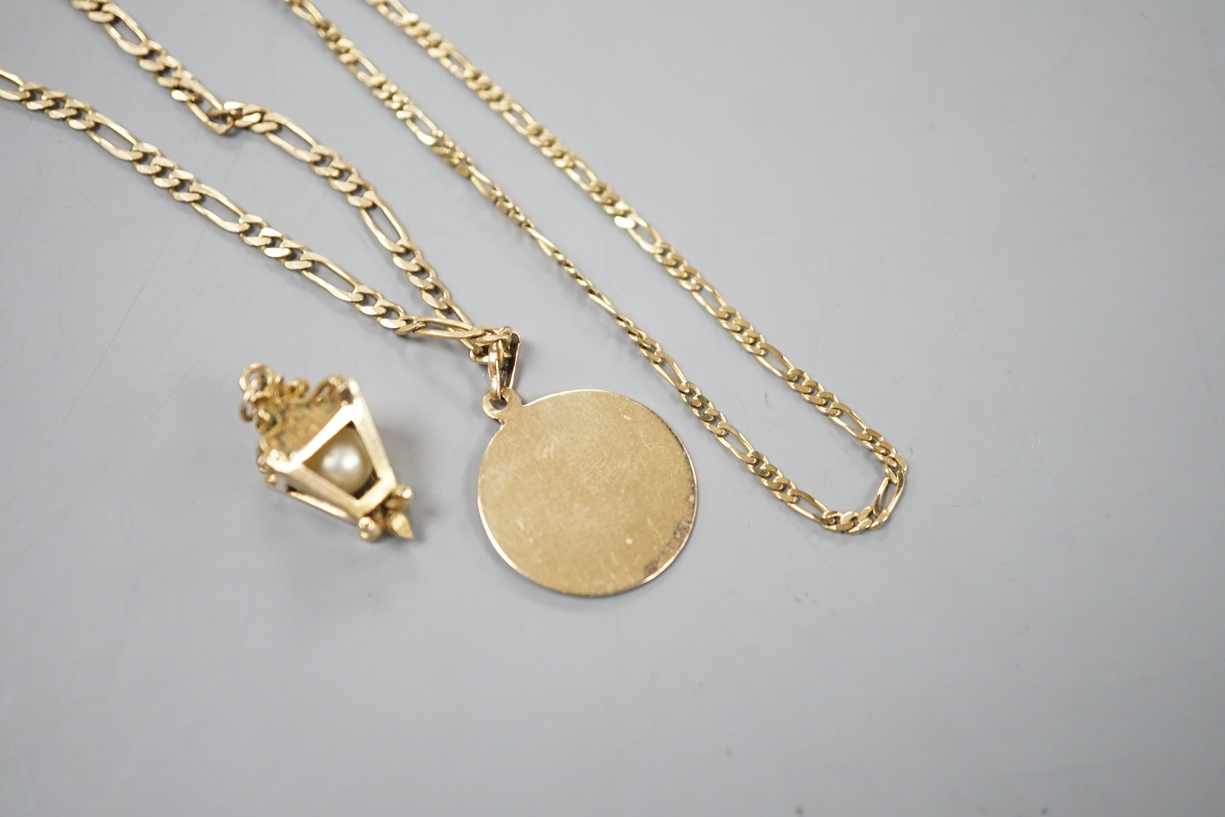A modern 9ct gold chain with lantern pendant and a 9ct chain with 9ct circular pendant, gross 16.9 grams.